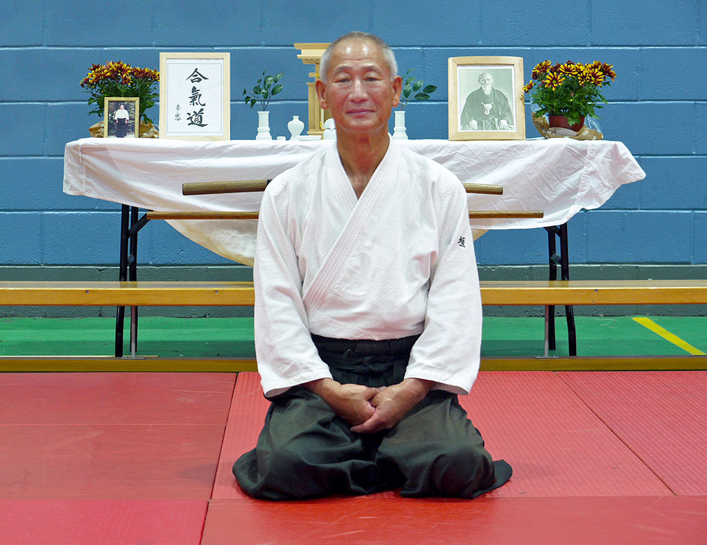 Shigemi Inagaki Shihan sitting in front of the kamiza